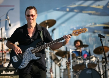 Gary Sinise playing bass