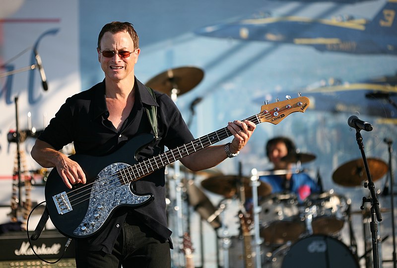 Gary Sinise playing bass