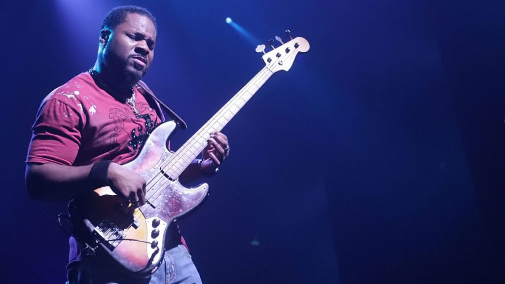 Malcolm-Jamal Warner playing bass